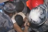 Man being pulled from rubble in Nepal