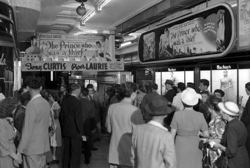 Crowd outside the Piccadilly Theatre at the entrance in Piccadilly Arcade, 1951