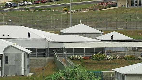 Risdon Prison tactical response group members on top of a roof in December 2009.