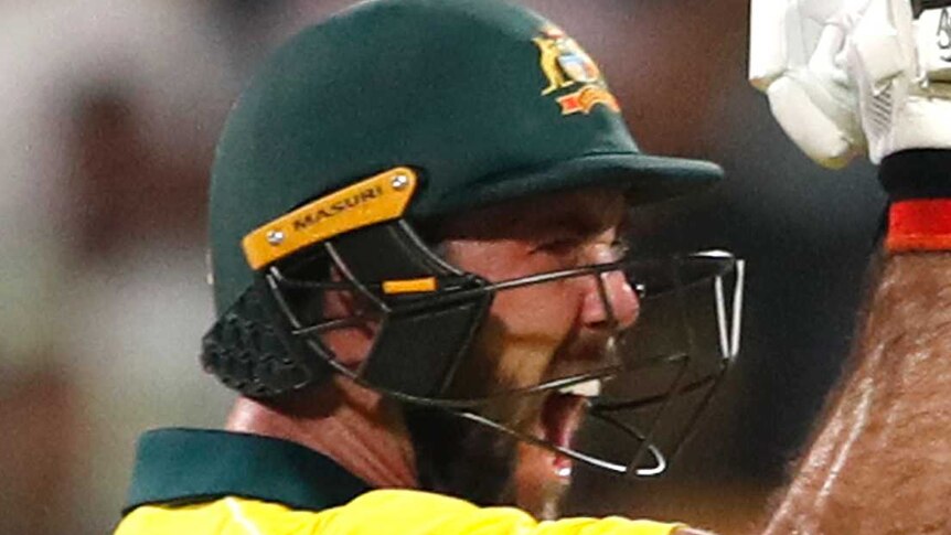 Australia batsman Glenn Maxwell pumps his fist as he celebrates beating India in a Twenty20 match.