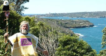 Paul Delprat, wearing a crown and self-styled robes, stands above the Principality of Wy