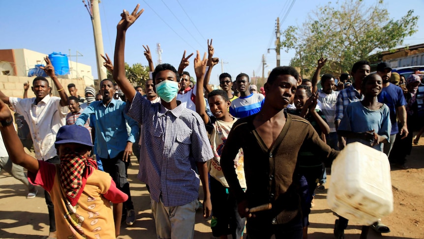 Sudanese demonstrators march during anti-government protests.