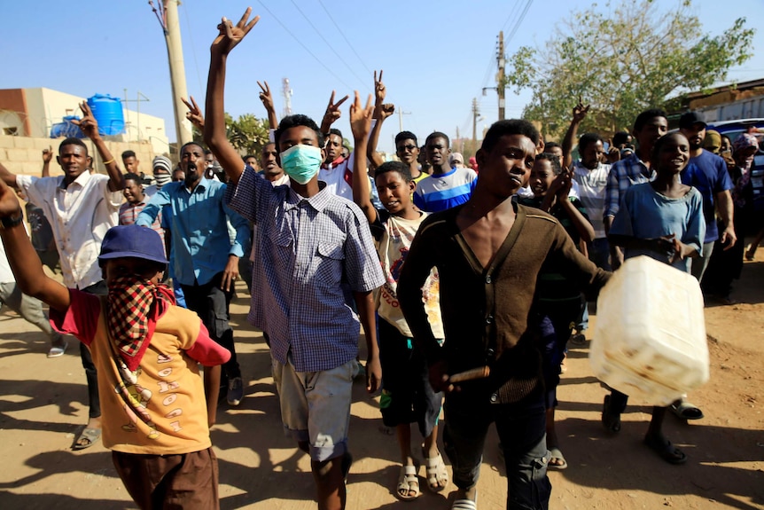 Sudanese demonstrators march during anti-government protests.
