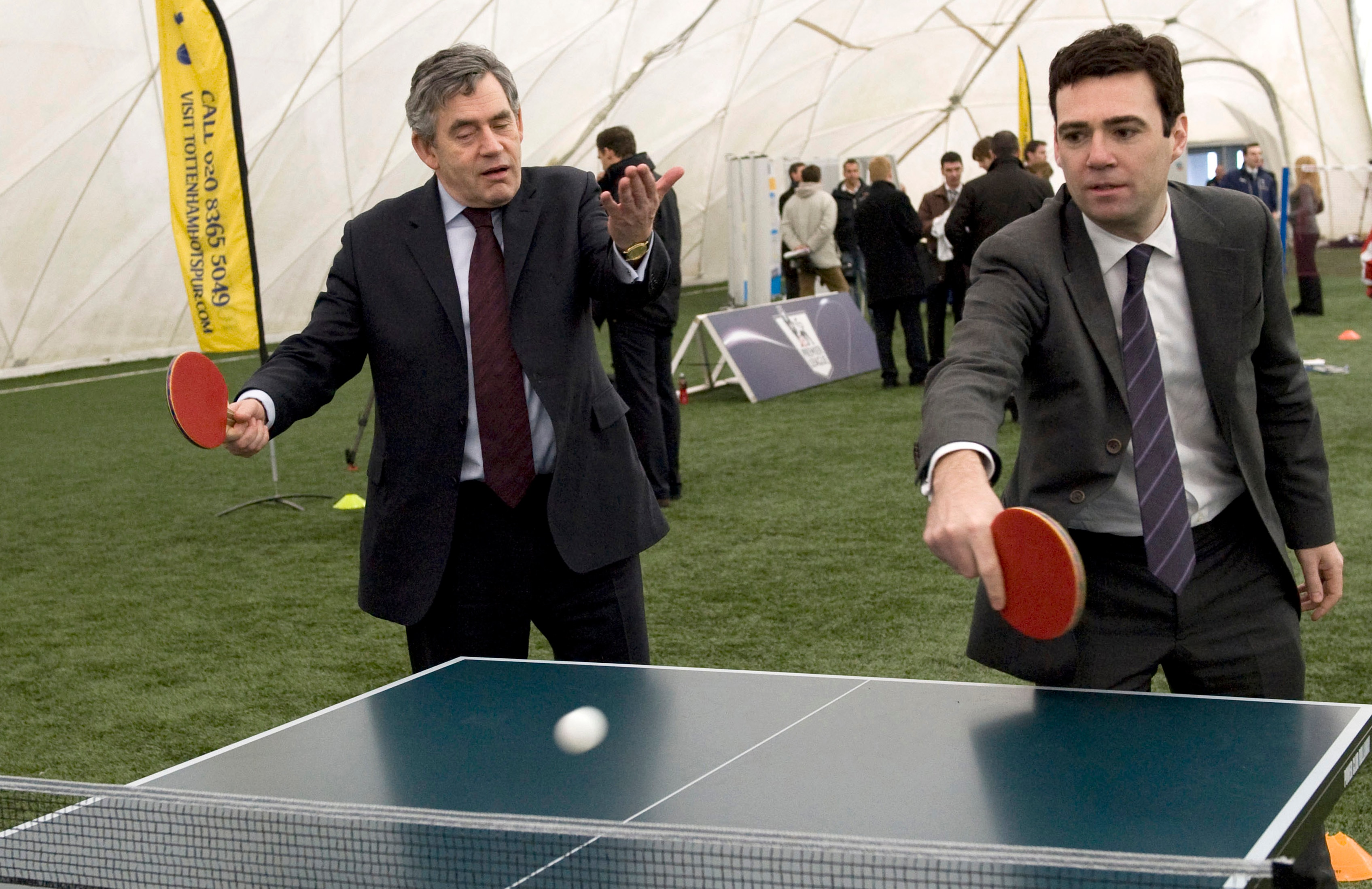 A man plays table tennis.