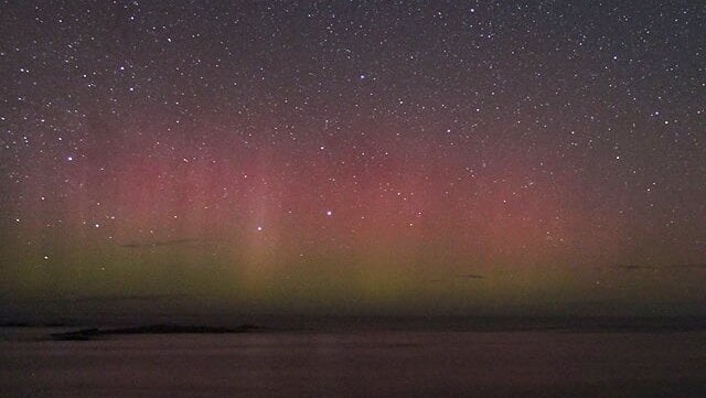 The lights of Aurora Australis over some water