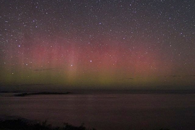 The lights of Aurora Australis over some water