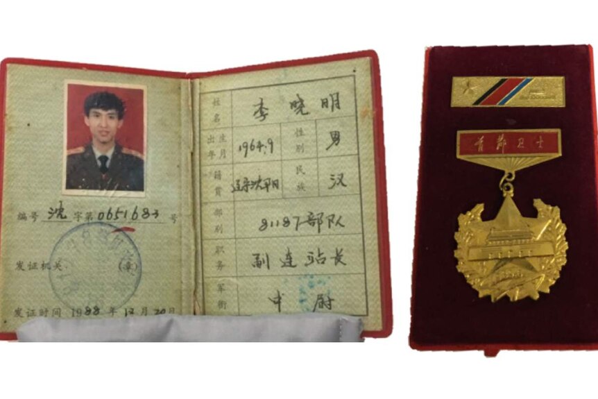 Xiaoming Li's military identification certificate (left) and his Capital Guard Commemorative Medal (right).