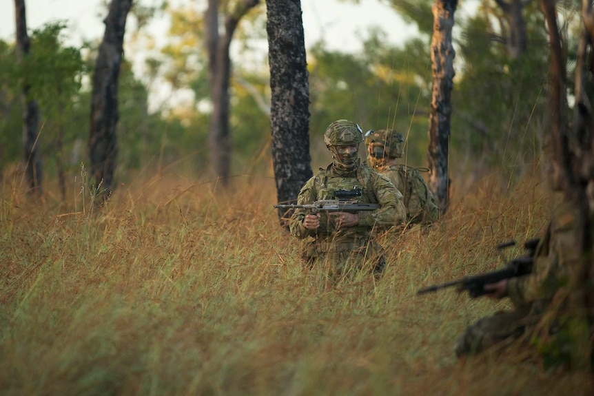 Soldiers from 5RAR train in the bush.