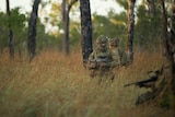 Soldiers from 5RAR train in the bush.