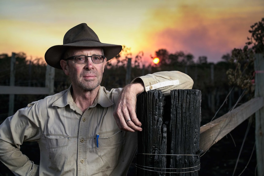 Topper's Mountain vineyard owner Mark Kirkby stands in his vineyard after fire decimated his 2019 vintage.