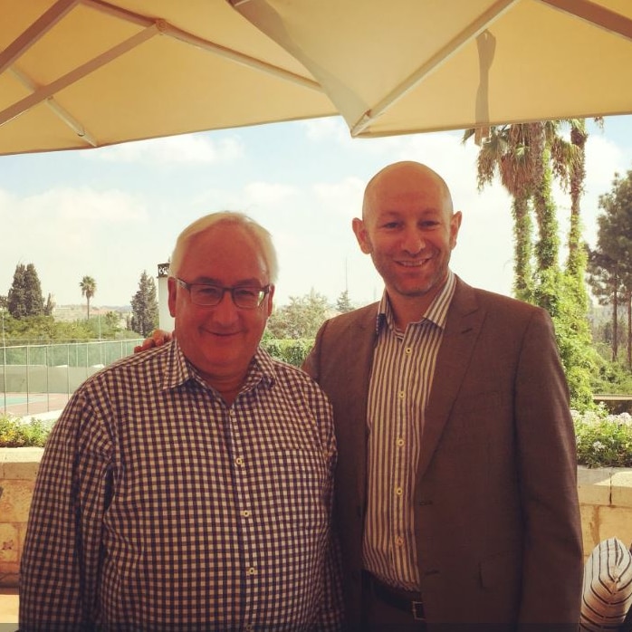 Arsen Ostrovsky, an Australian man who directs the Israeli-Jewish Congress, with his arm around Labor MP Michael Danby