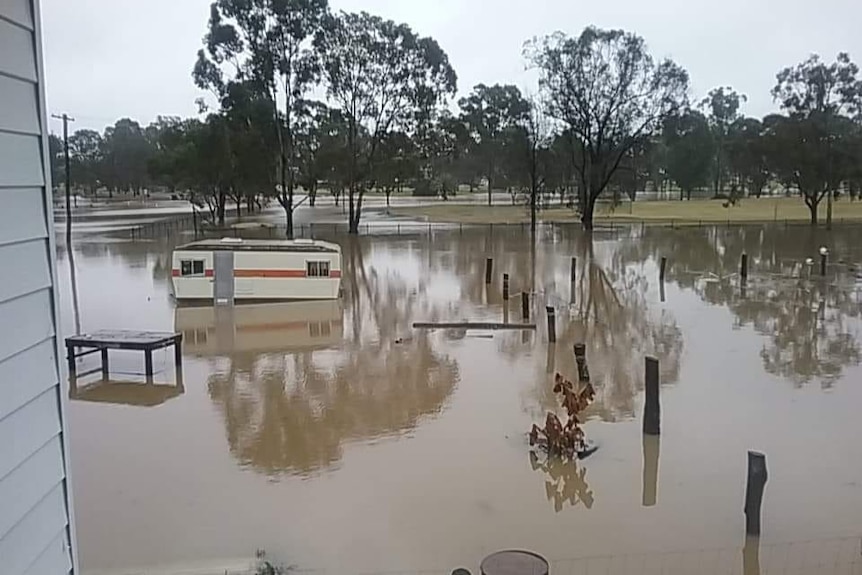 A caravan sits in floodwaters