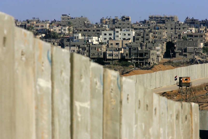Egyptian border post overlooks Israel's protective barrier.