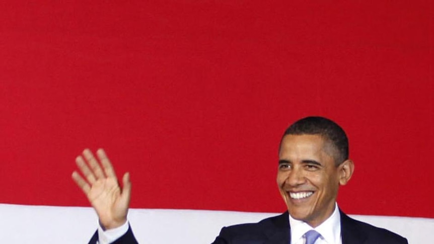 Barack Obama arrives on stage to deliver a speech at the University of Indonesia