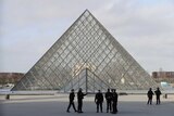 French police secure the site near the Louvre Pyramid in Paris