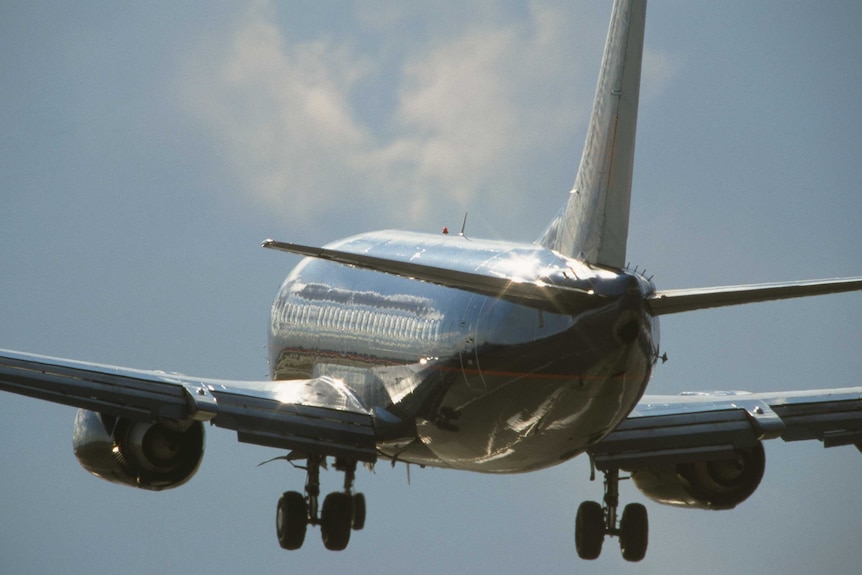 Tight shot of a generic large jet in the sky.