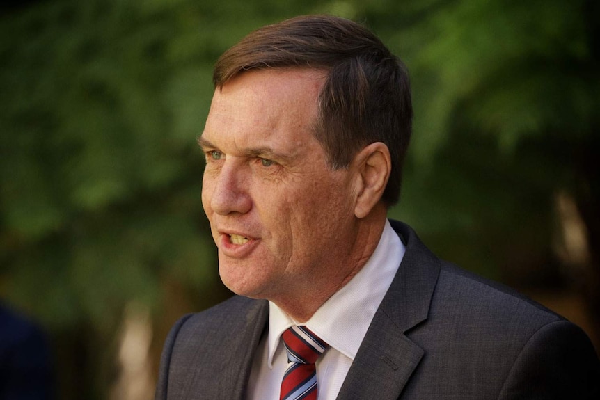 Former minister Dr Anthony Lynham speaking at a media conference in Brisbane