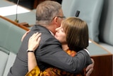 Nicola Roxon hugs Anthony Albanese after valedictory speech.