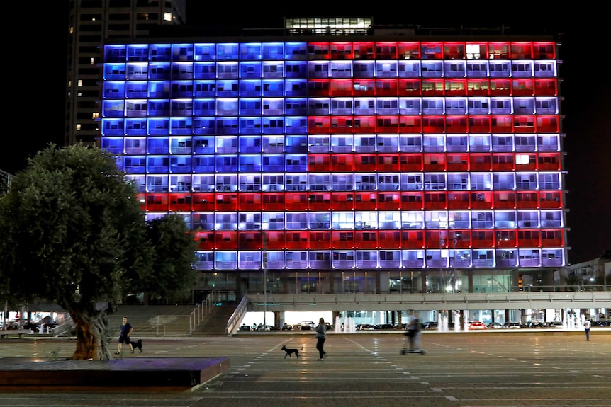 a building lit up like the American flag