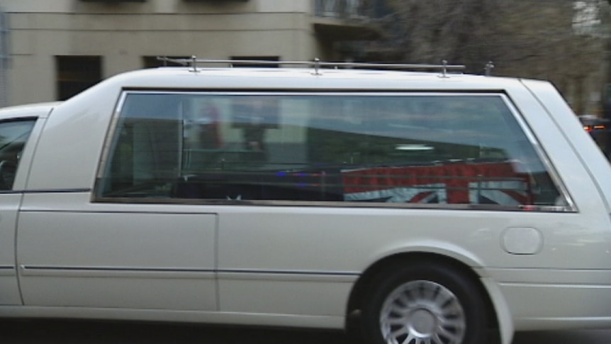 Nine hearses drove from Melbourne Airport to the morgue at Southbank.