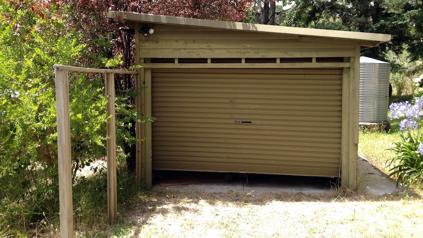 The car rolled into the nearby garage