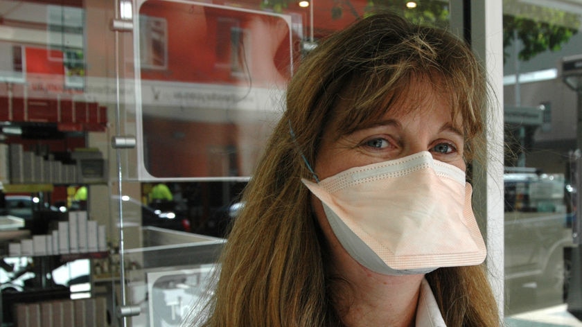 Brisbane woman with surgical mask.