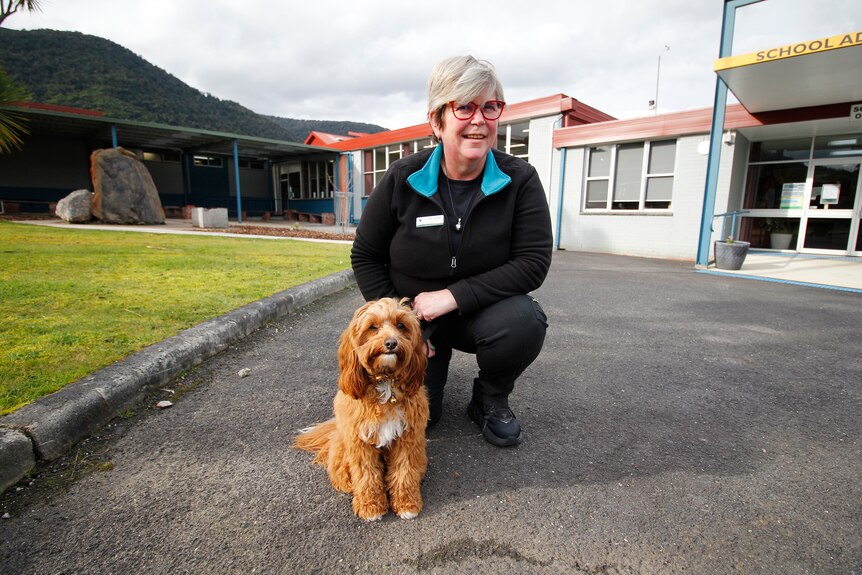 A therapy dog with her carer at Rosebery District School