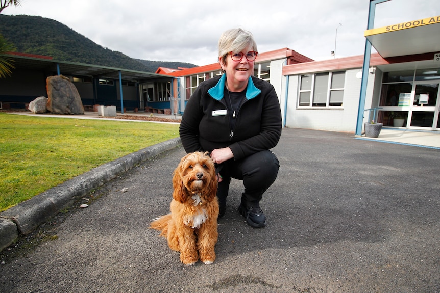 A therapy dog with her carer at Rosebery District School