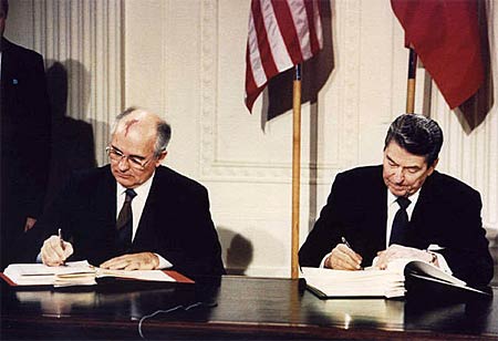 Ronald Reagan signs a treaty with the Soviet Union in 1987.