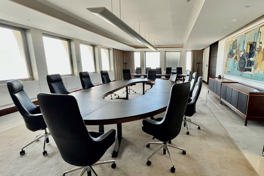 A wide shot of the empty Reserve Bank of Australia boardroom.