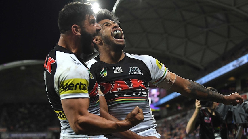 Josh Mansour (left) and Waqa Blake of the Panthers react to a try against Melbourne Storm.