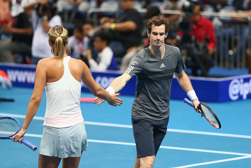 Maria Sharapova and Andy Murray celebrate a point won in their doubles match at the International Premier Tennis League