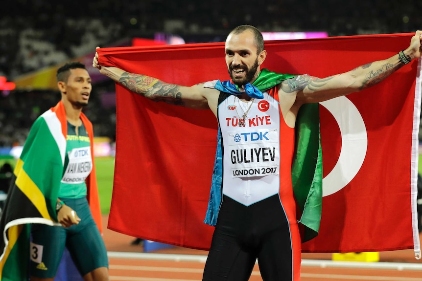 Turkey's Ramil Guliyev and Wayde van Niekerk after winning the 200-metre final at the world titles.