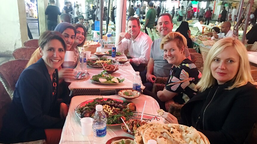 Emma Alberici joins her delegation at dinner in a traditional Kuwait souk.