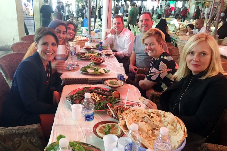 Emma Alberici joins her delegation at dinner in a traditional Kuwait souk.