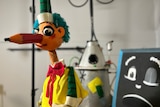 three puppets including a blackboard and mr squiggle with a long pencil nose