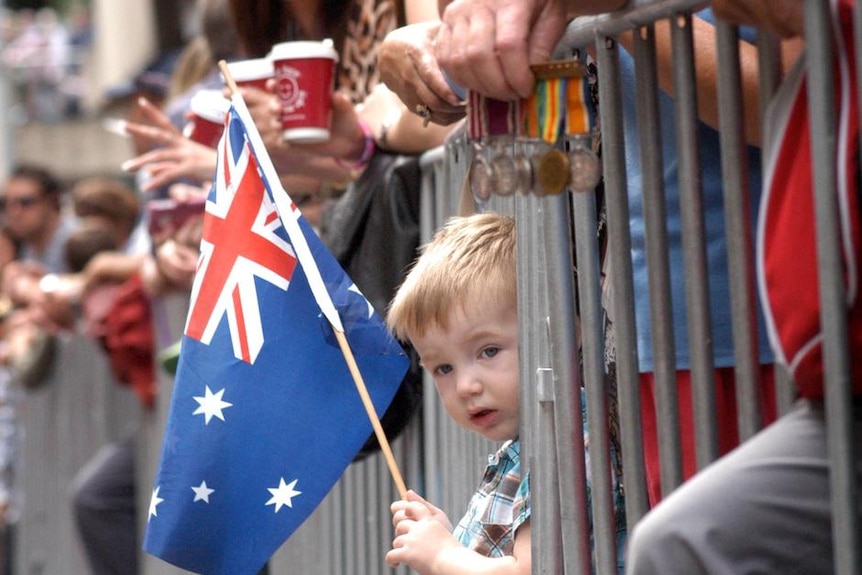 Two-year-old Aled Miller waits for the ANZAC Day march