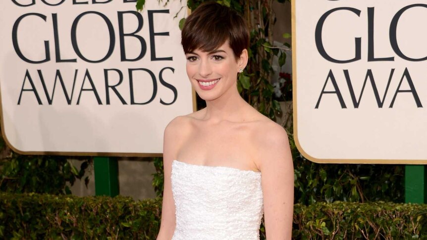Anne Hathaway arrives at the Golden Globes.