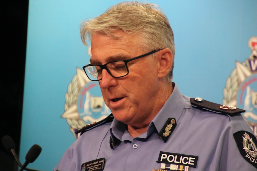 A close-up photo of Assistant Commissioner Allan Adams wearing glasses.