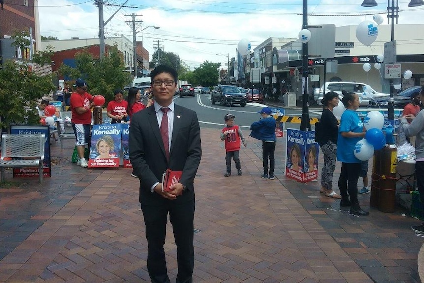 Sean Kim, from the Korean Society of Sydney, stands in Eastwood Mall in the northern Sydney seat of Bennelong.