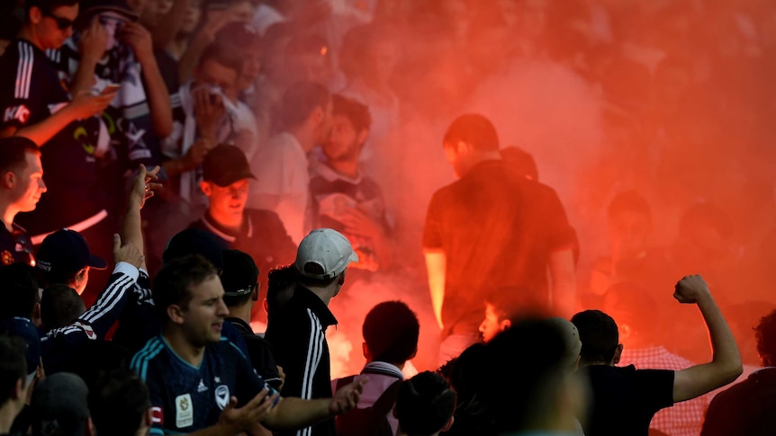 Crowds on notice ... Victory fans light a flare during last Saturday night's Melbourne derby at AAMI Park