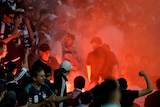 Crowds on notice ... Victory fans light a flare during last Saturday night's Melbourne derby at AAMI Park