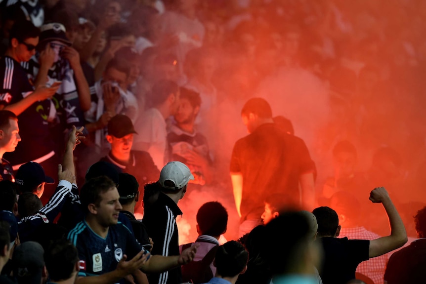 Melbourne Victory fans let off flares against Melbourne City at AAMI Park