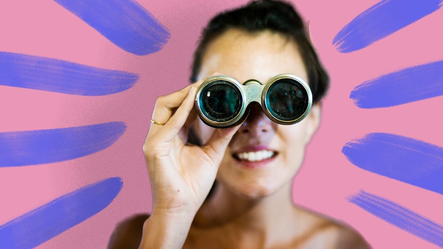 Woman looking through binoculars for story about looking through your own bias