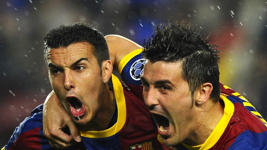 Too much class... Barcelona forward Pedro Rodriguez (l) celebrates with team-mate David Villa after scoring the opener at the Nou Camp.