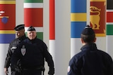 Paris police patrol entrance of COP21 venue