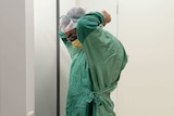 A surgeon prepares for a medical procedure.