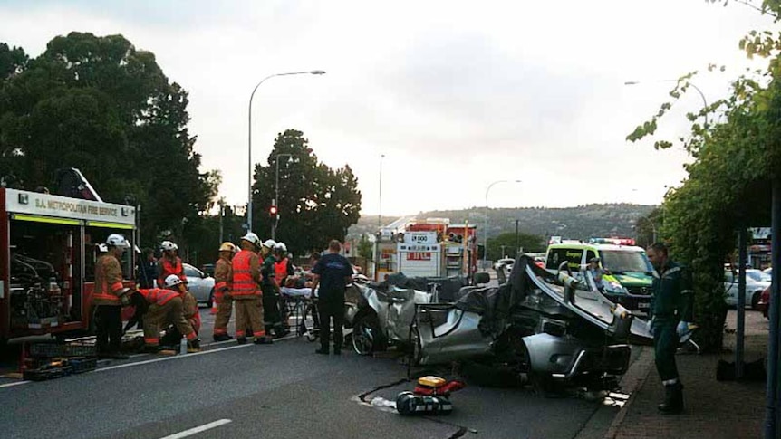 Emergency crews had to cut a man out of his vehicle after it and others were hit by a runaway truck on Glen Osmond Road in Adelaide.