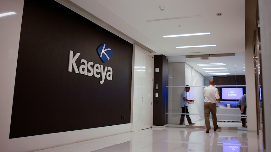 Staff enter the headquarters of information technology firm Kaseya in Miami.