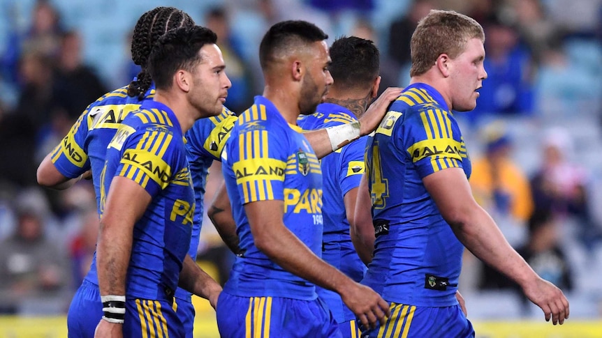 Parramatta Eels players pat Daniel Alvaro on the back after he scored a try.